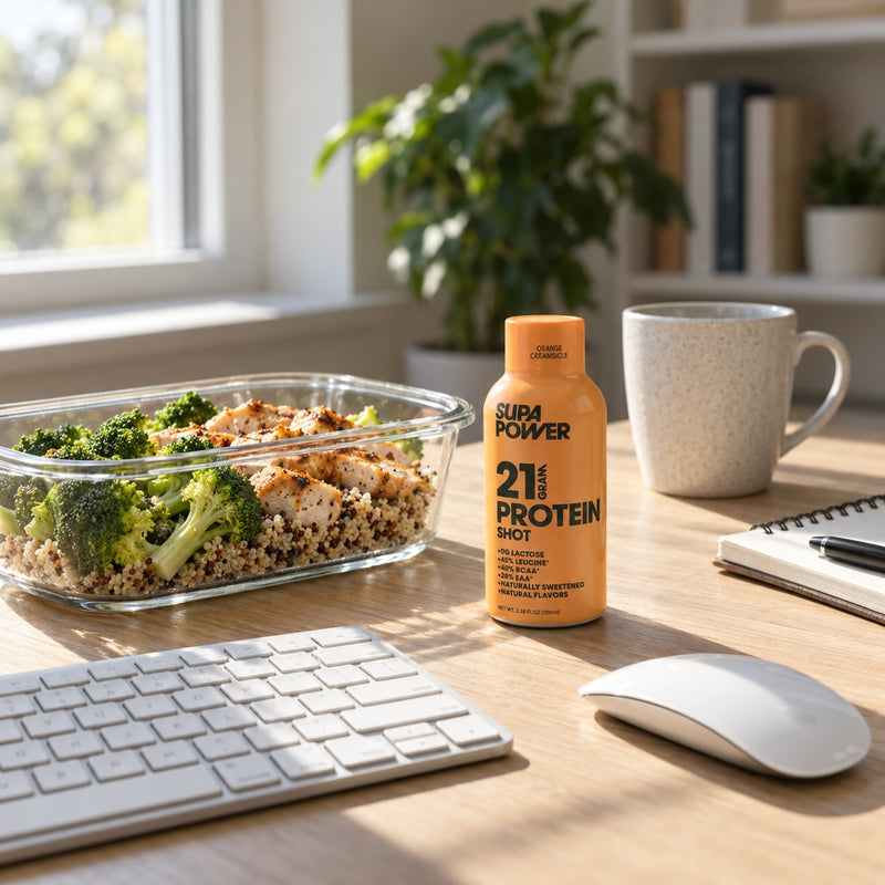 A SUPA POWER shot on a desk with a salad when life gets in the way